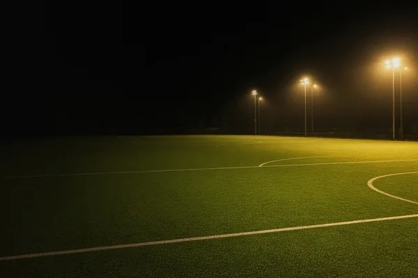 A football pitch under gold floodlights on the CroreBet sports page.